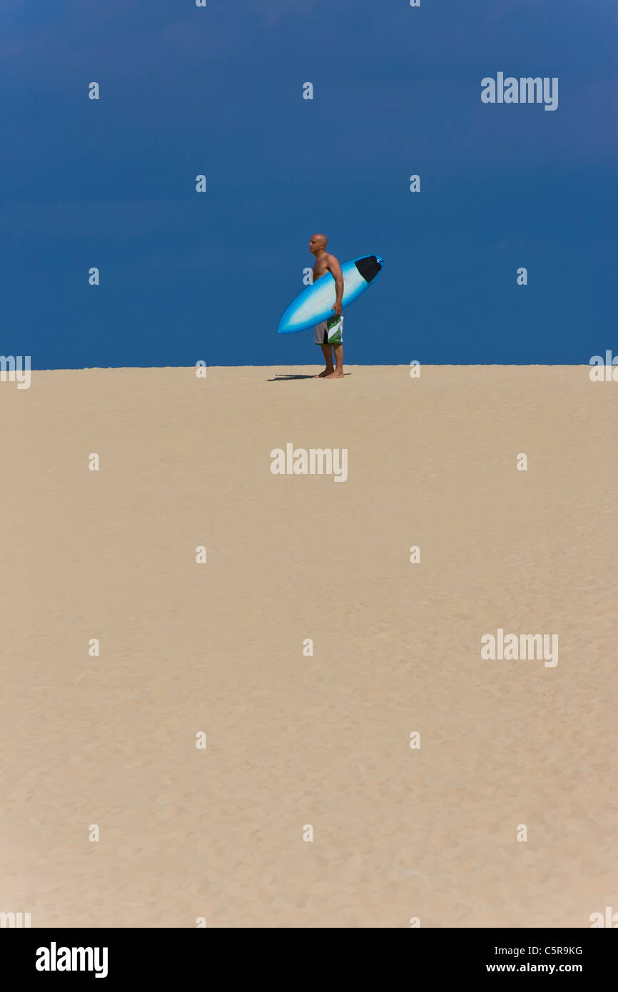Surfer standing surfboard on hi-res stock photography and images - Alamy