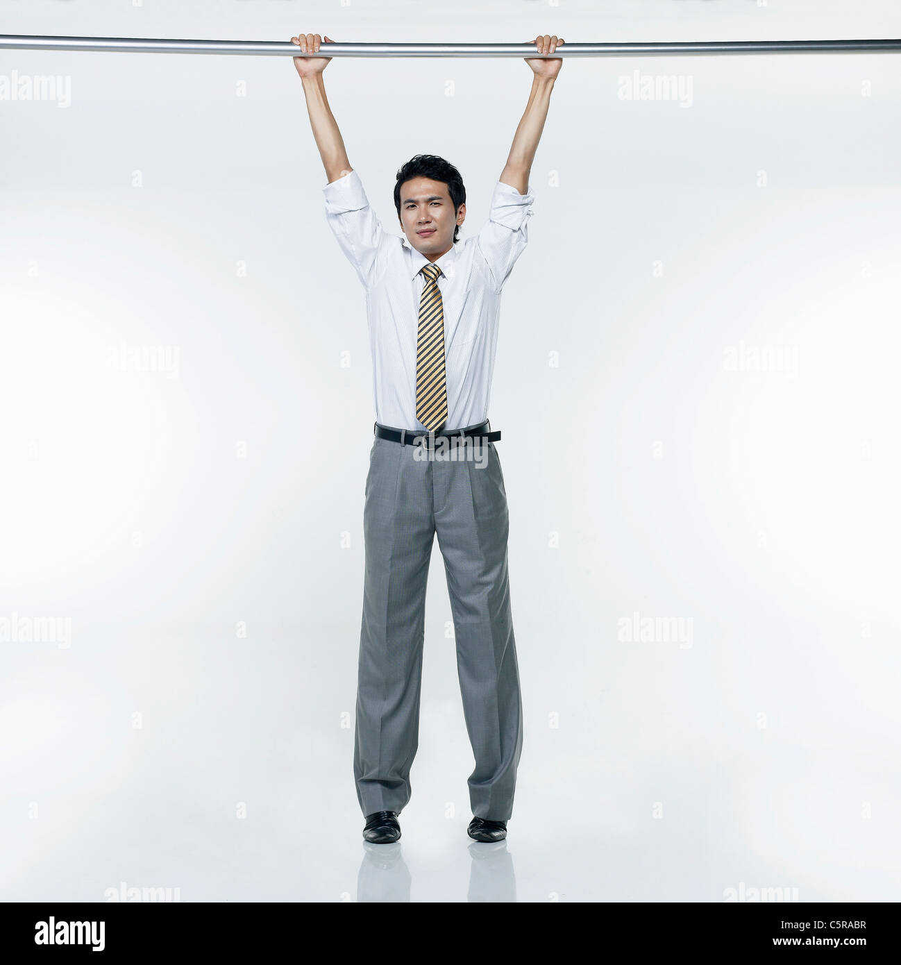 A Man Sitting Under the Pull Up Bar · Free Stock Photo
