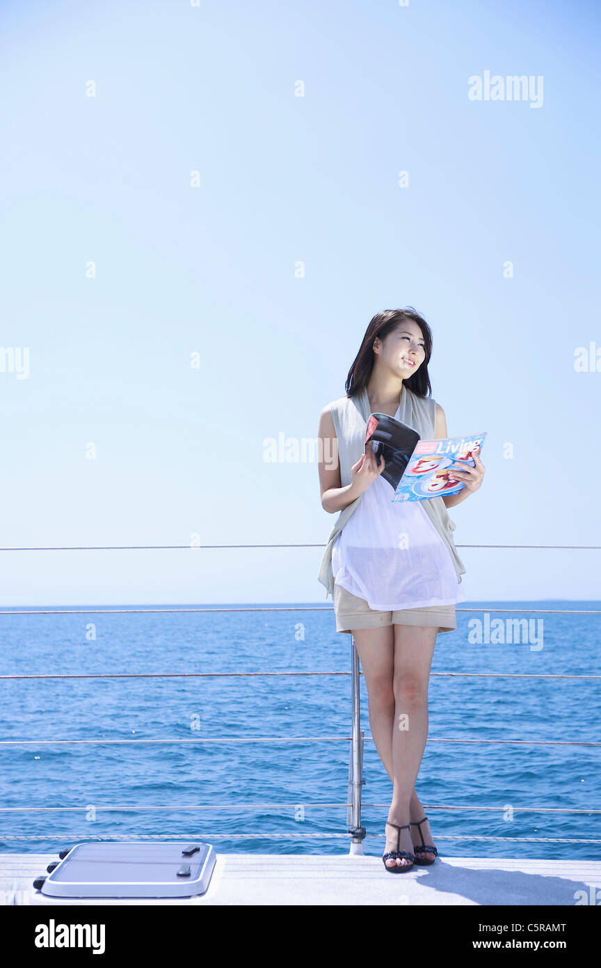 Smiling woman leaning on boat hi-res stock photography and images - Alamy