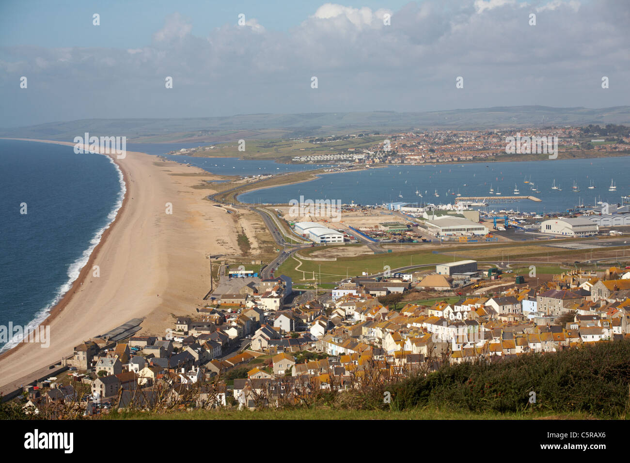 Aerial image of Chesil Beach Chesil Bank, 29 km long shingle beach, a  tombolo connecting mainland to the Isle of Portland, Jurassic Coast, UNESCO  Worl - SuperStock