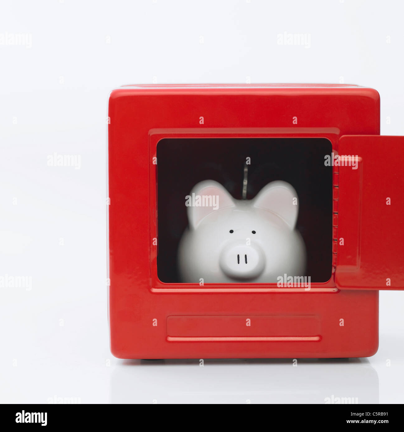 A piggy bank inside a safe Stock Photo Alamy