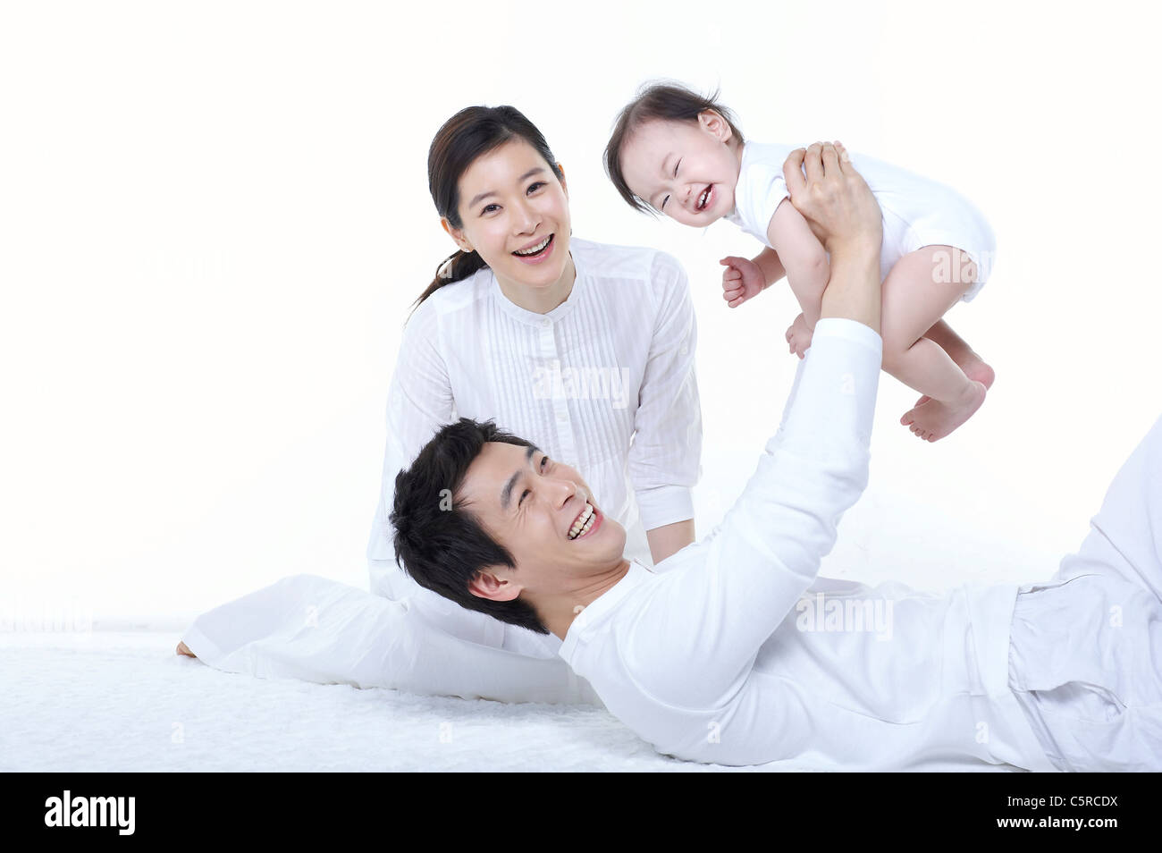 A family having a good time with their baby Stock Photo