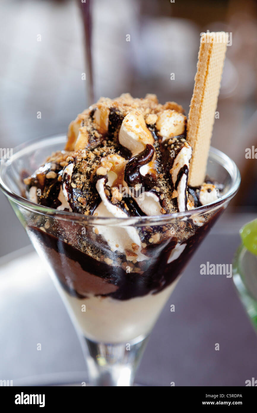 Close up of brittle sundae made with mocha icecream, whipped cream and chocolate sauce Stock Photo