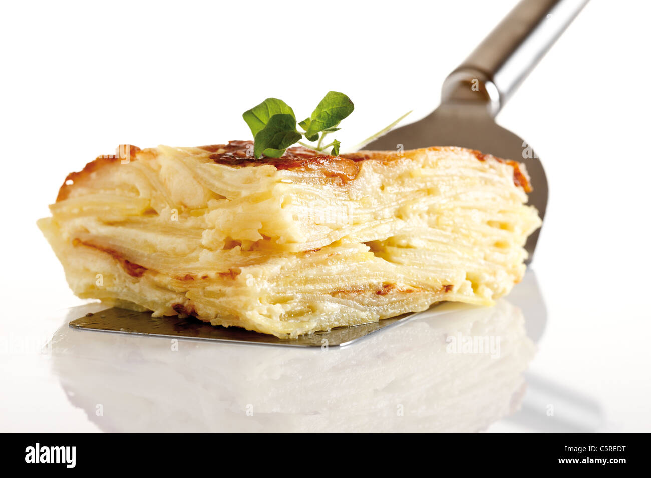 Piece of potato bake on plate, elevated view Stock Photo