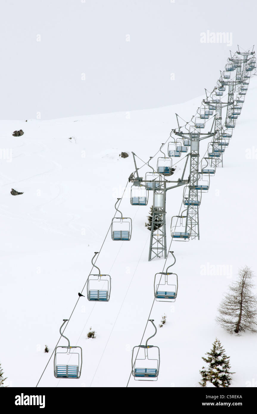 Switzerland, GraubÃ¼nden, Arosa, Empty ski lift chairs, elevated view Stock Photo