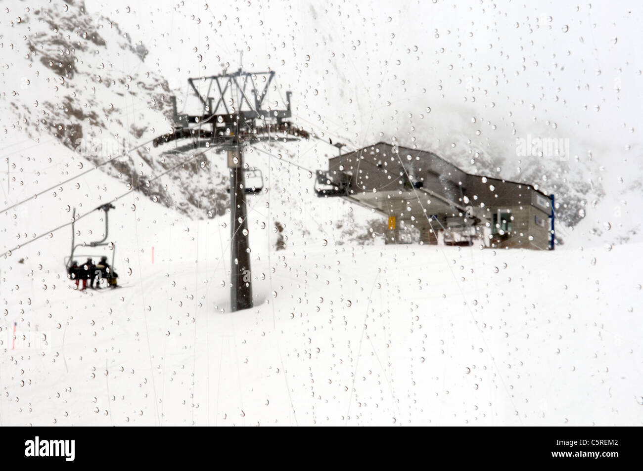 Switzerland, GraubÃ¼nden, Arosa, Skiers riding chairlift Stock Photo