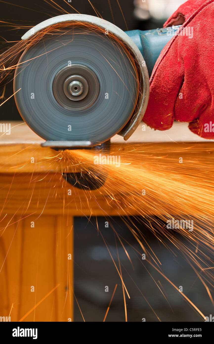 cutting steel with a small grinder Stock Photo