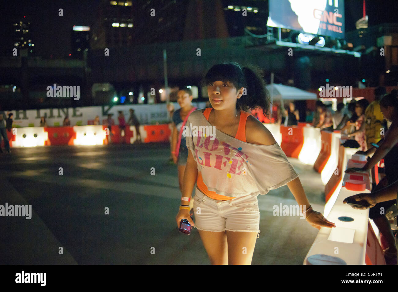 Roller skaters of various skill levels maneuver the new rink below the