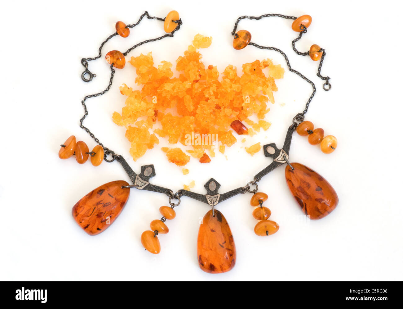 Figural amber display & pewter necklace depicting folk dancers from Russia. Stock Photo