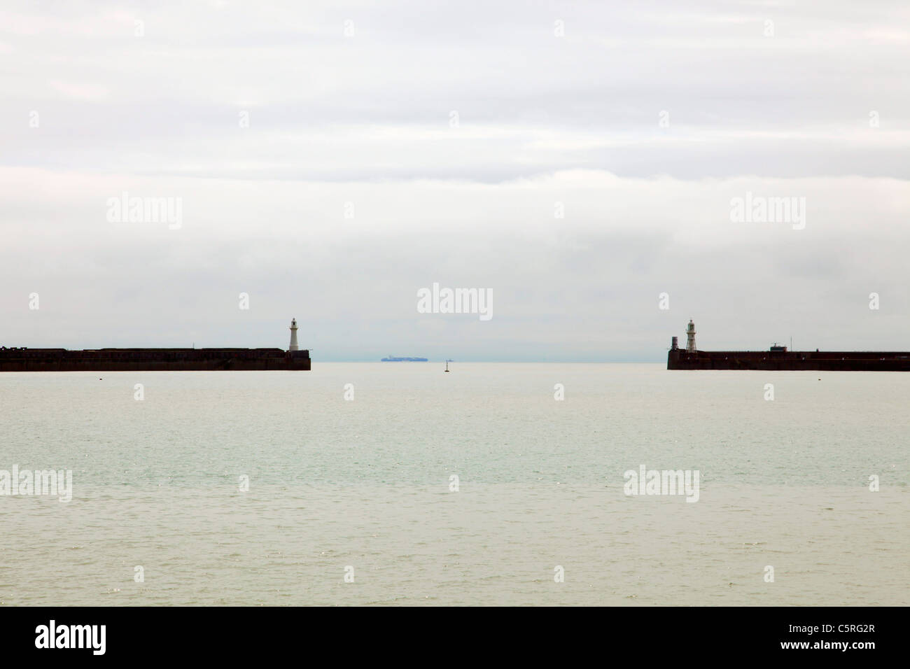 Twin lighthouses on harbour wall Dover Kent Stock Photo