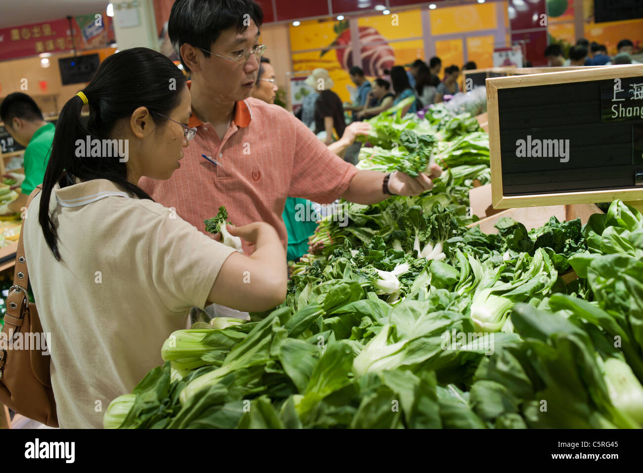 Shoppers Choose Bok Choy At The New Sky Foods Supermarket In The