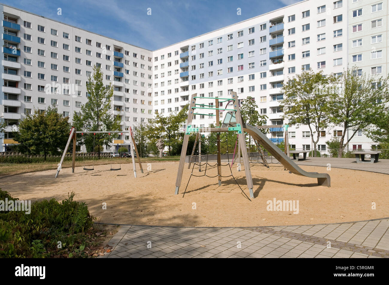 Empty playground, Plattenbau, pre-fabricated concrete buildings, social housing, residential estate, Jena, Thuringia, Germany, E Stock Photo