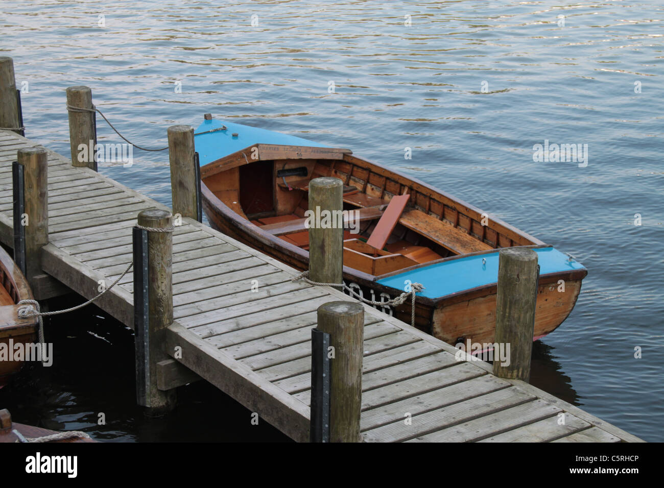 Jetty and moored boat, Lake Windermere, The Lake District, Cumbria, UK Stock Photo
