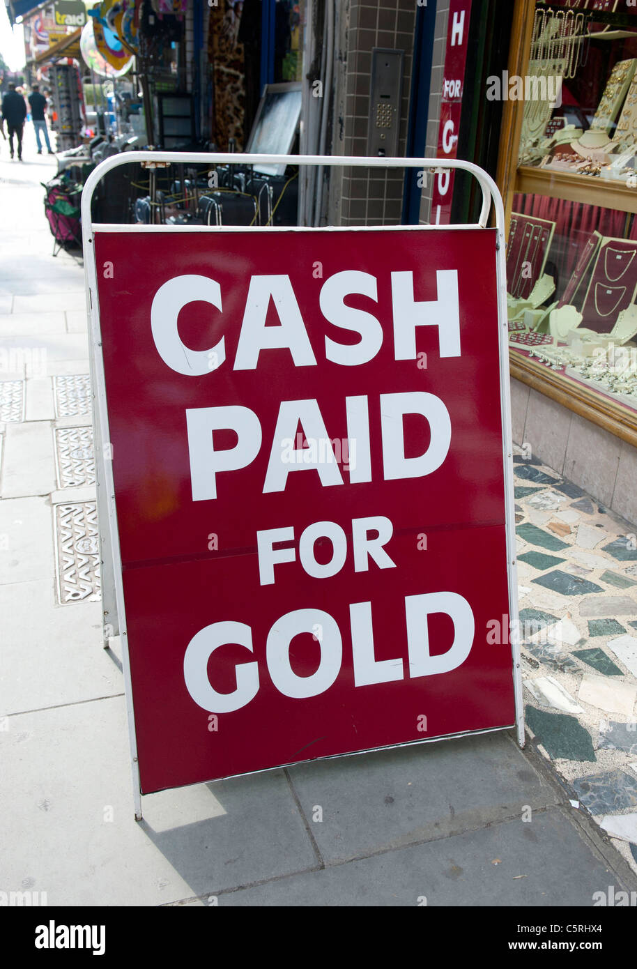 Sign advertising 'cash for gold' outside a pawn shop in Hammersmith, Lodon, UK Stock Photo