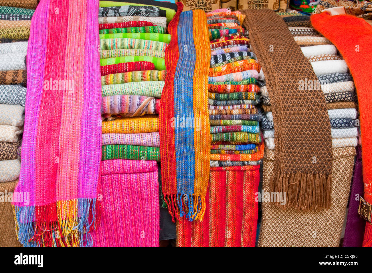 Closeup of colorful blankets and textiles in the street markets of Pisac, Urubamba Valley, Peru, South America. Stock Photo