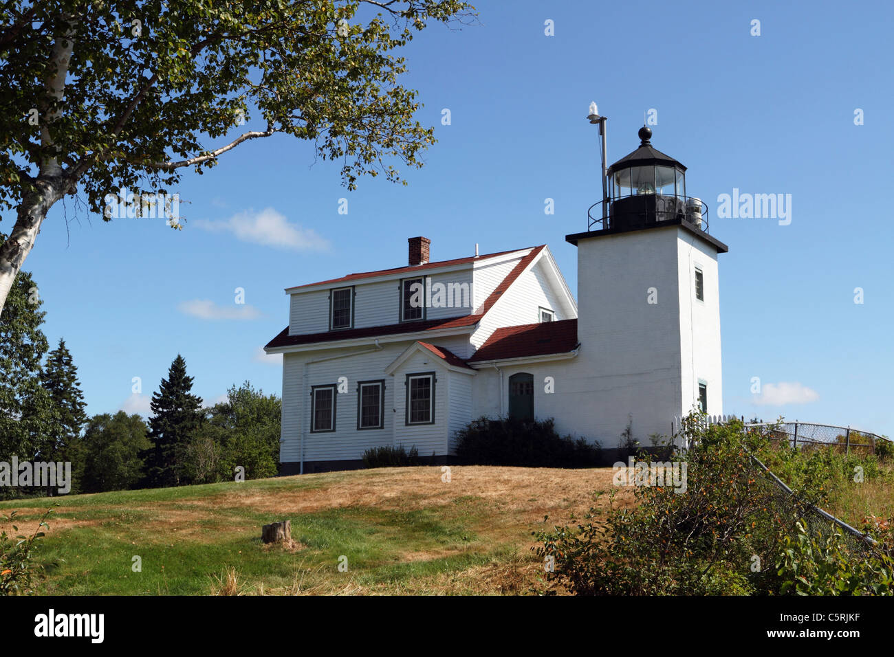 Fort Point Lighthouse in Fort Point Light State Park, Maine, USA. The lighthouse is on Penobscot Bay. Stock Photo