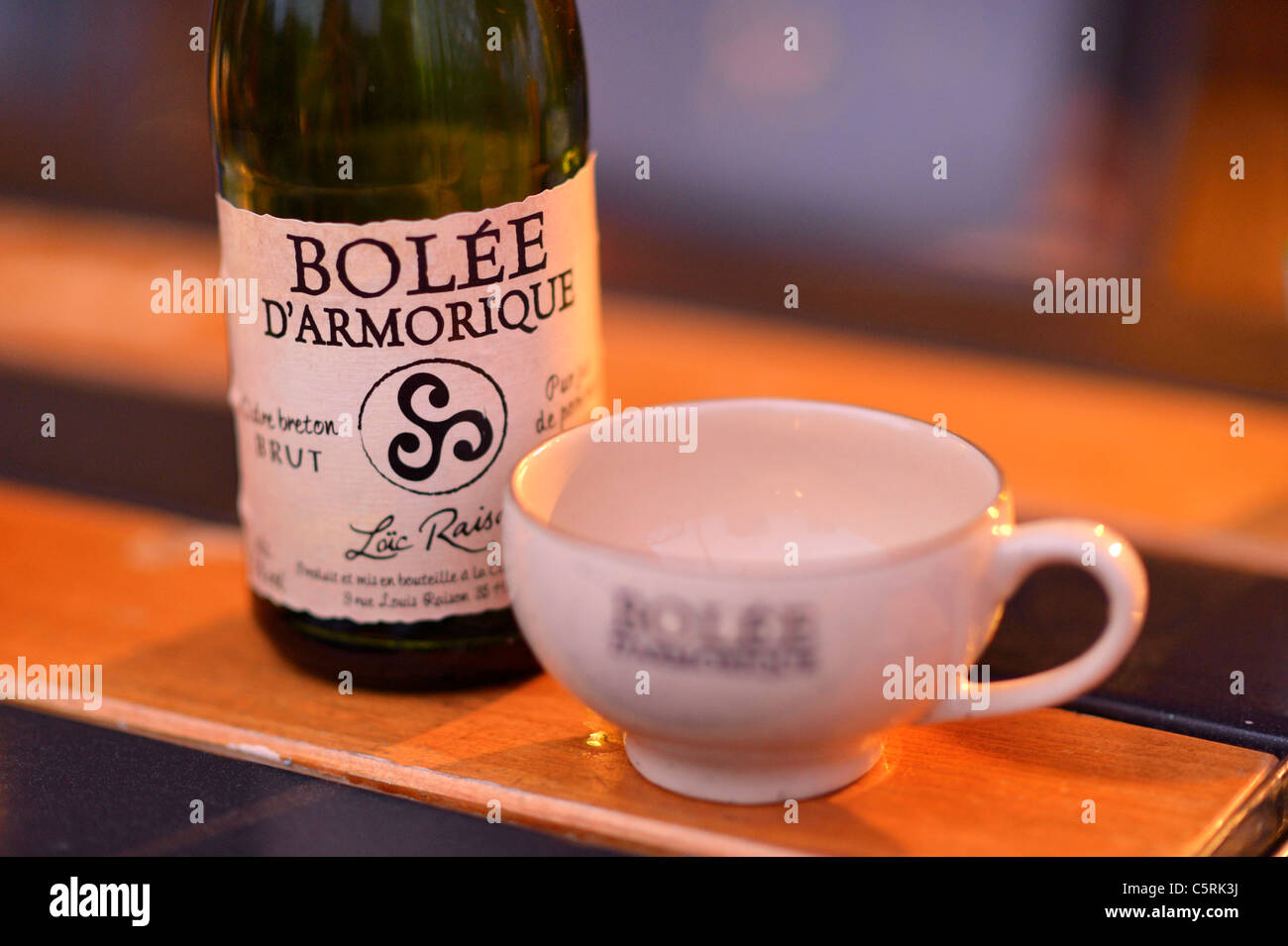 Cider bottle and bowl the traditional drink from Brittany, France FR