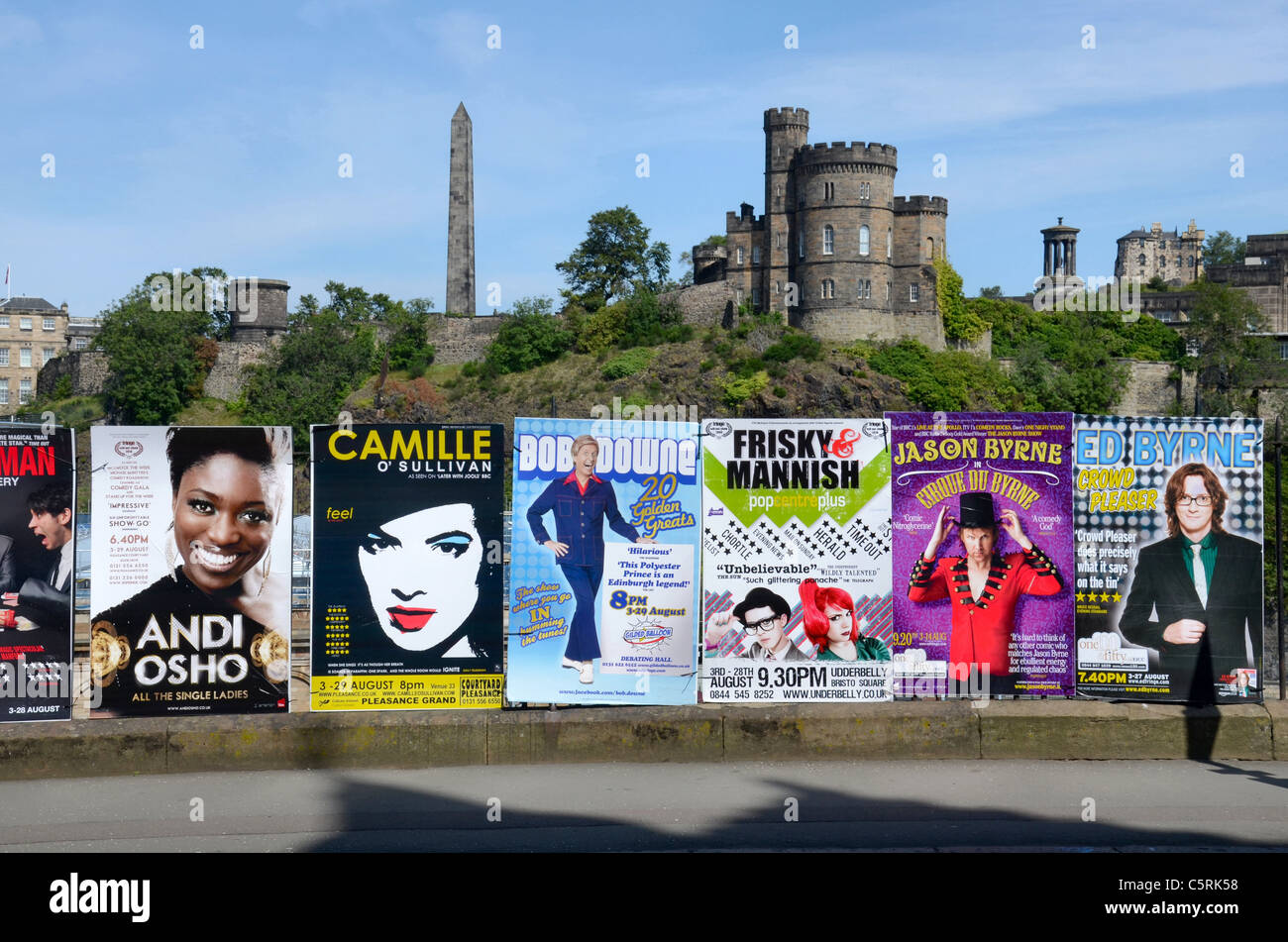 Posters advertising edinburgh fringe shows against the backdrop of