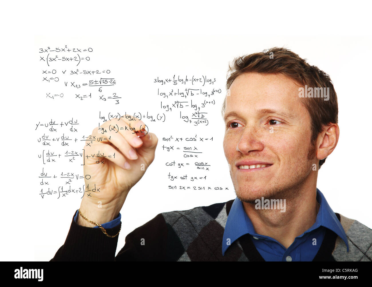 portrait of young man writing on glass board isolated on white Stock Photo