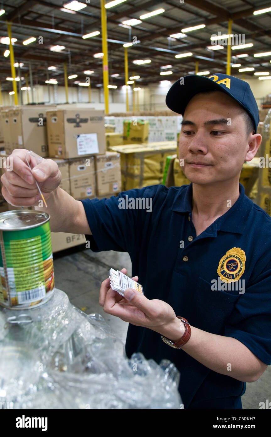 Feb. 4, 2009; Los Angeles, CA – An FDA field inspector prepares samples of imported food for laboratory analysis. Stock Photo