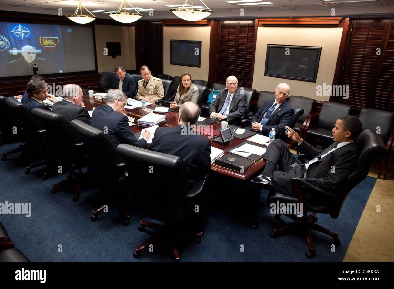 Obama and Vice President Joe Biden hold a secure teleconference call on Libya in the Situation Room of the White House Stock Photo