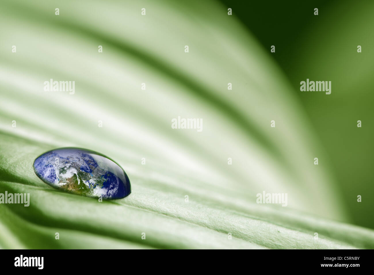 Planet earth in drop of water Stock Photo