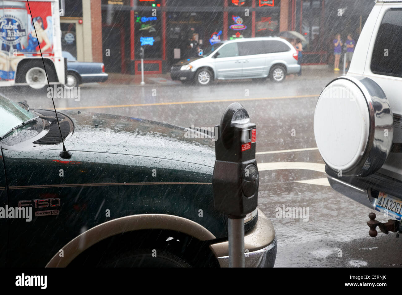 heavy rain on car hood downtown broadway Nashville Tennessee USA Stock Photo