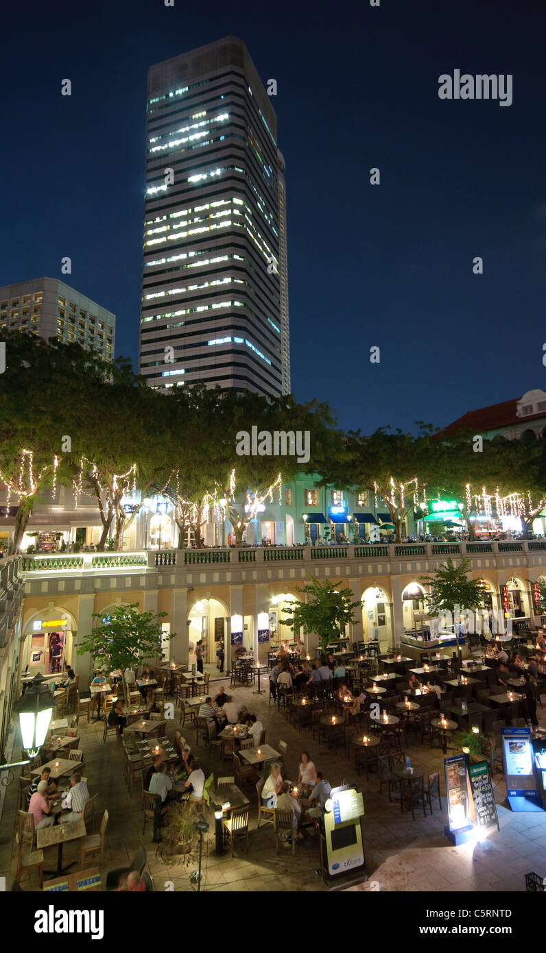 Restaurants and bars at Fountain Court at night, office building at