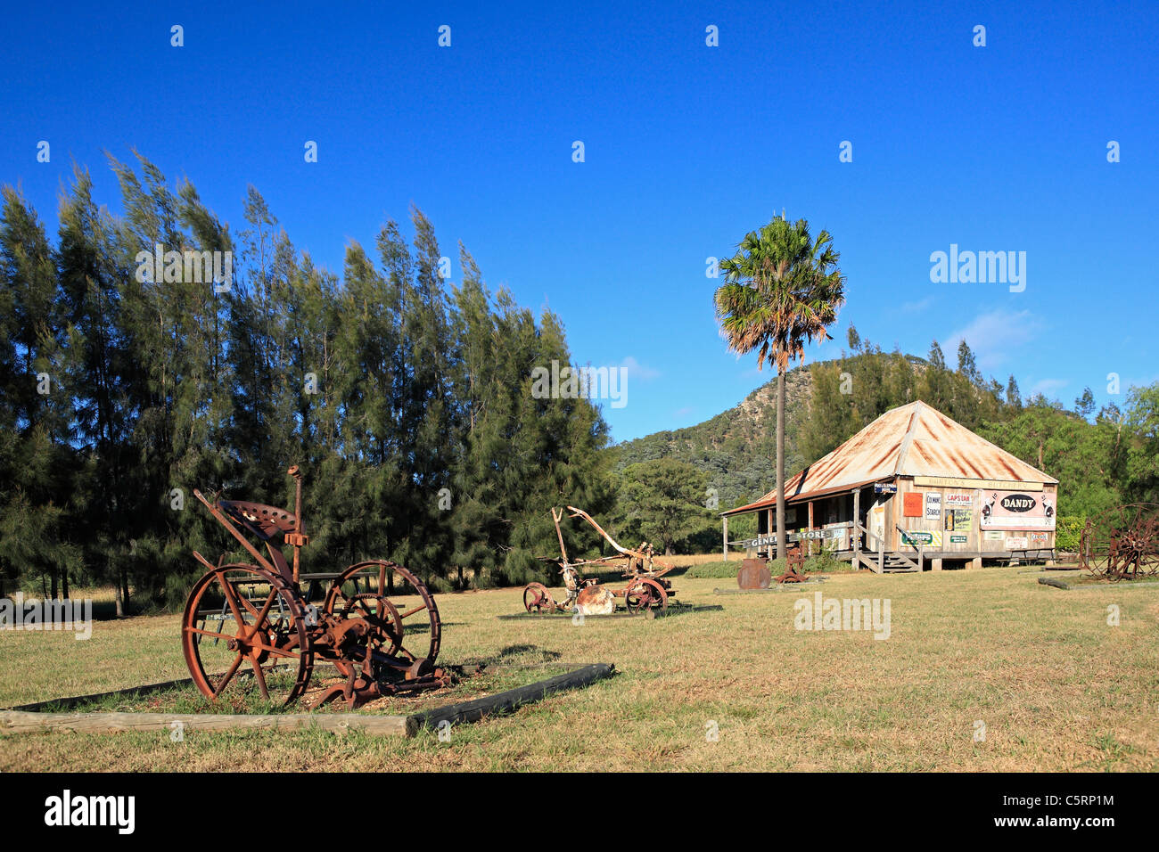 Historic old slab cottage and machinery in the grounds of Oakvale Winery, Hunter Valley, NSW, Australia. Stock Photo