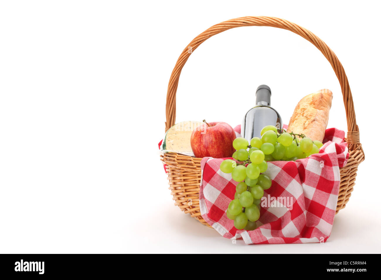 picnic basket with fruit bread and wine. Stock Photo