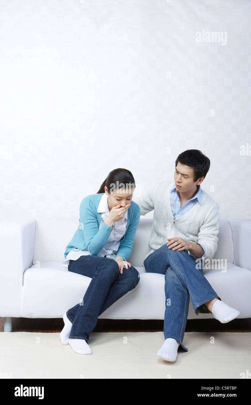 A woman with a man has morning sickness Stock Photo