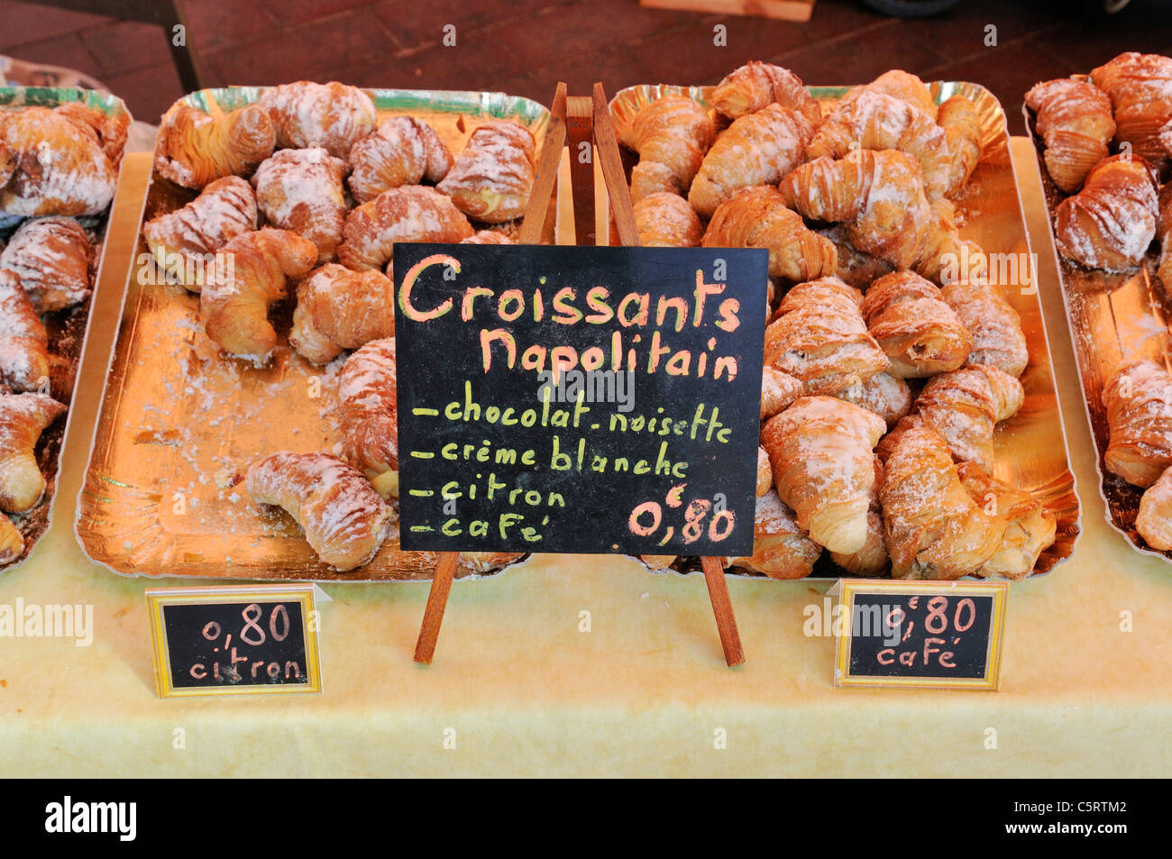 Europe, France, Provence, Alpes Maritimes, Cote d'Azur, Nice, Fresh baked crossaints with price tag on market stall Stock Photo
