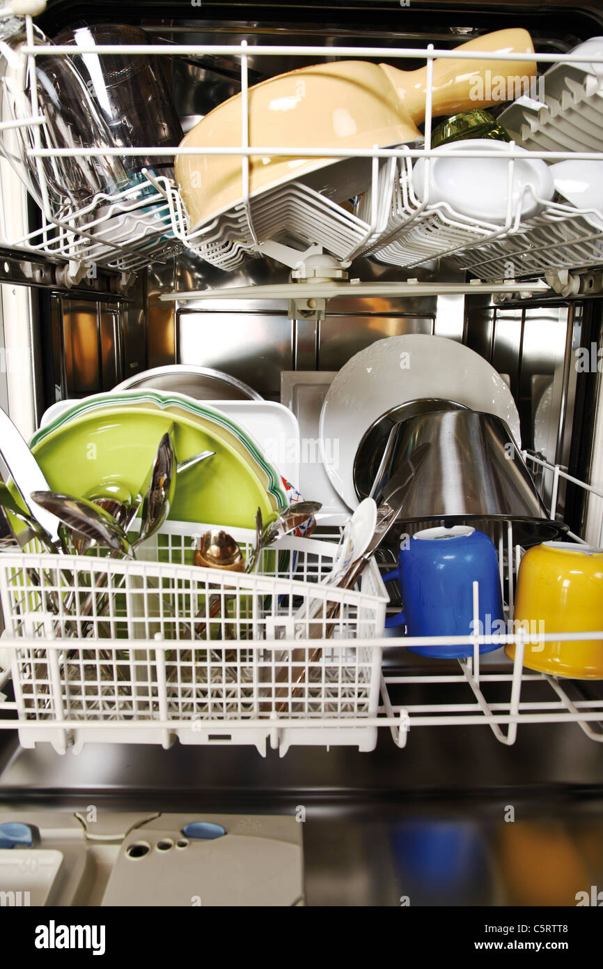 Cleaned dishes in open dishwasher, closeup Stock Photo Alamy