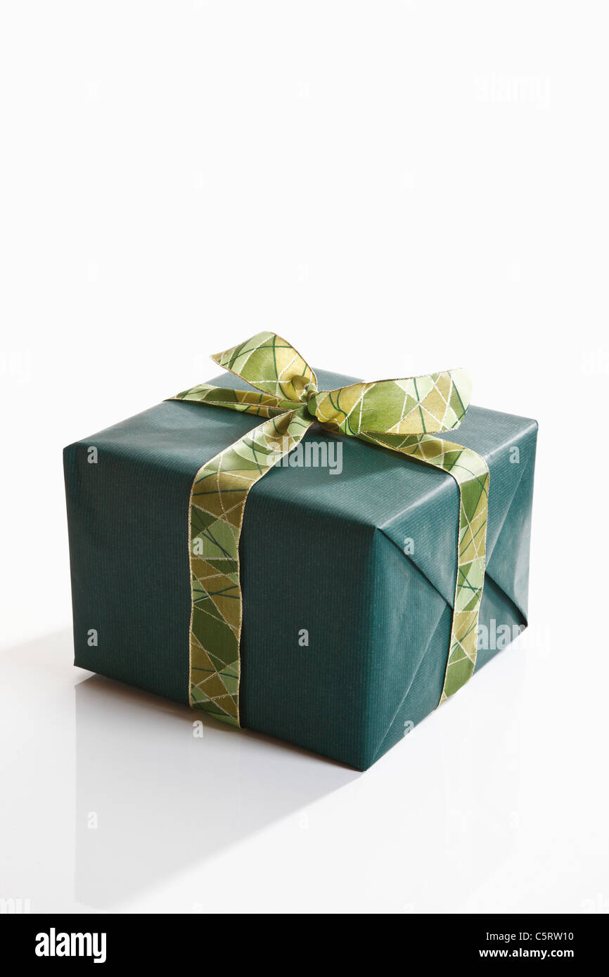 Gift wrapped with green wrapping paper Stock Photo