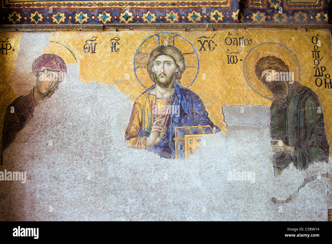 Deesis Mosaic of Jesus Christ (known as Christ Pantocrator) flanked by the Virgin Mary and John the Baptist in the Hagia Sophia Stock Photo