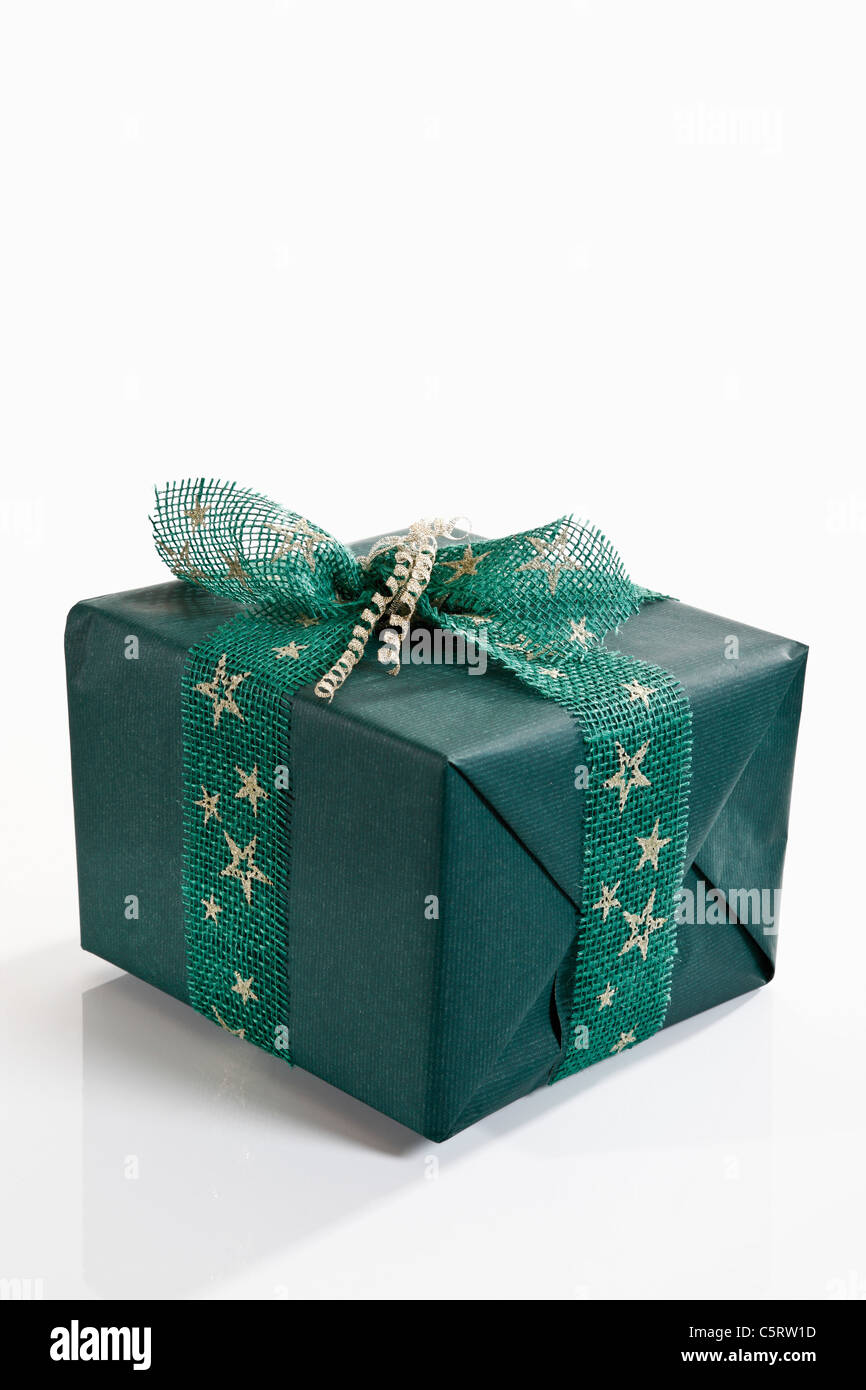 Gift wrapped with green wrapping paper Stock Photo