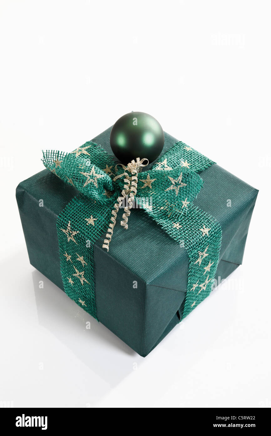 Gift wrapped with green wrapping paper Stock Photo Alamy
