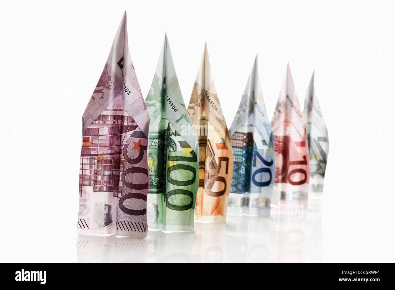 Paper aeroplanes folded from Euro banknotes Stock Photo