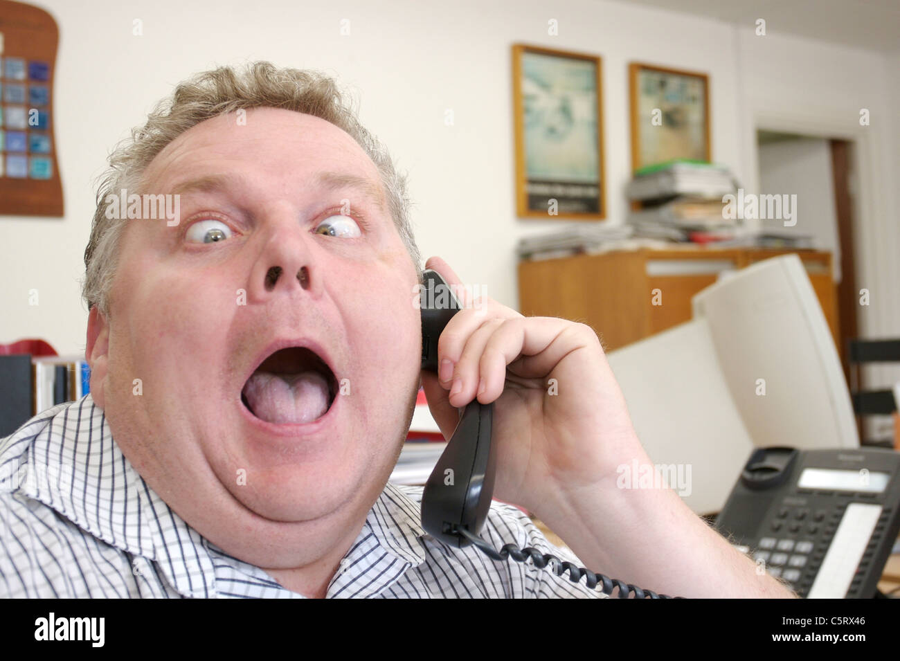 mad caller on the phone Stock Photo
