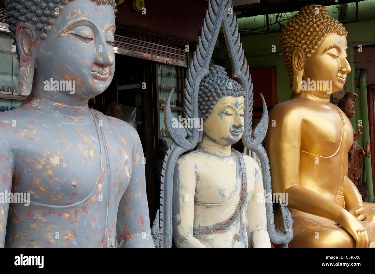 Buddha effigies for sale in Banglamphu, Bangkok Stock Photo