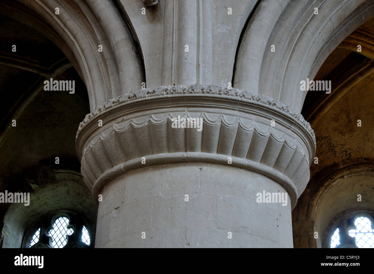 Carved stone capital, Malmesbury Abbey, Wiltshire, England, UK Stock Photo
