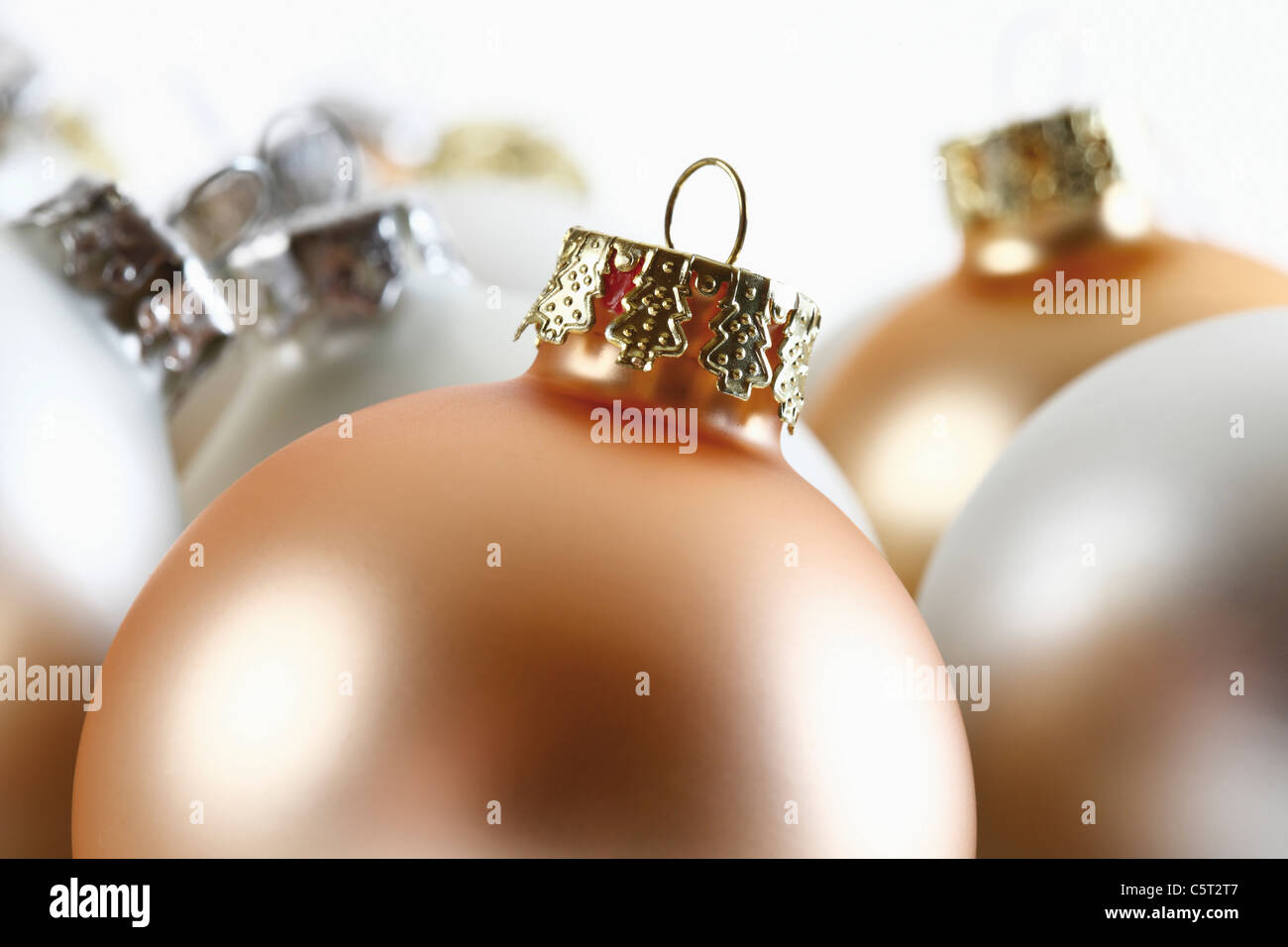 Christmas decoration, silver-coloured and golden christmas baubles, close-up Stock Photo