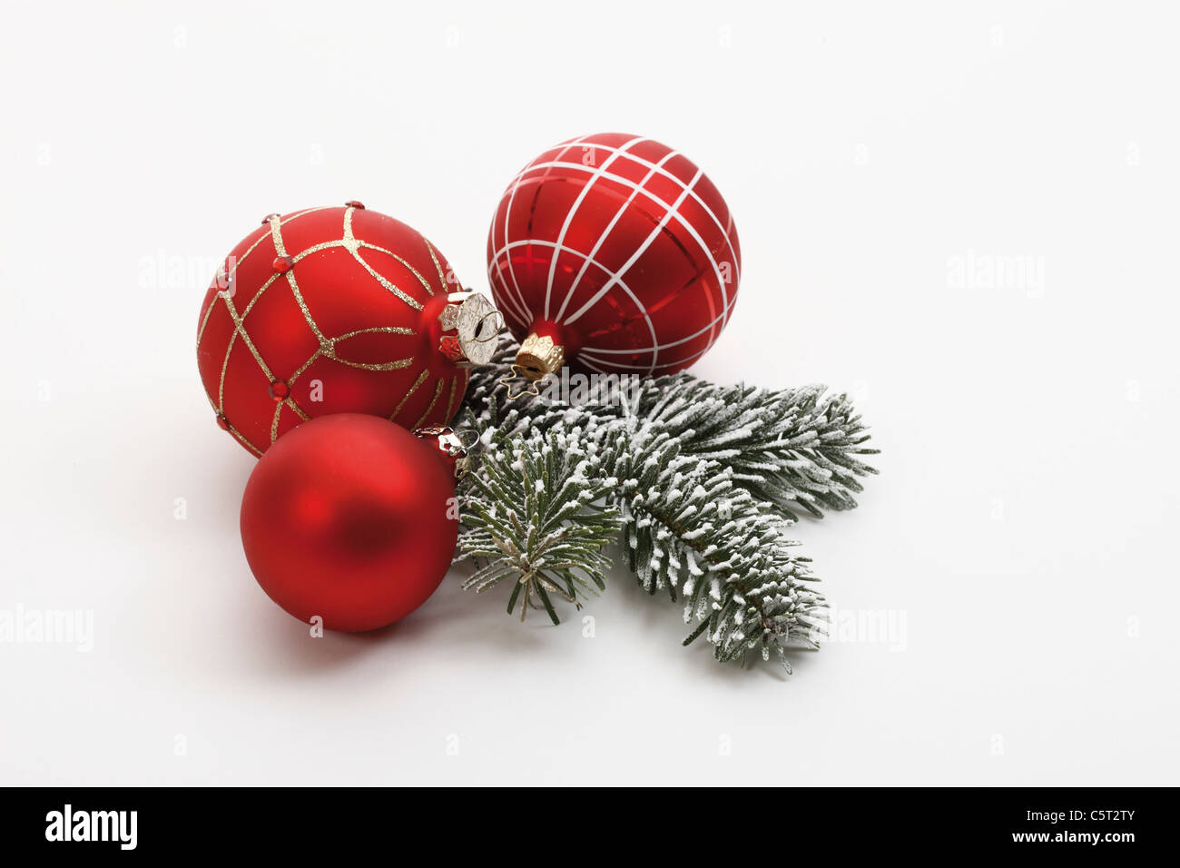 Christmas decoration, red christmas baubles and fir twig Stock Photo