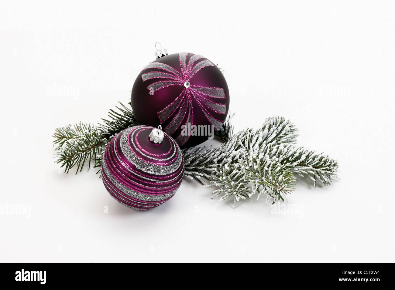 Christmas decoration, Lilac Christmas baubles and fir twig Stock Photo