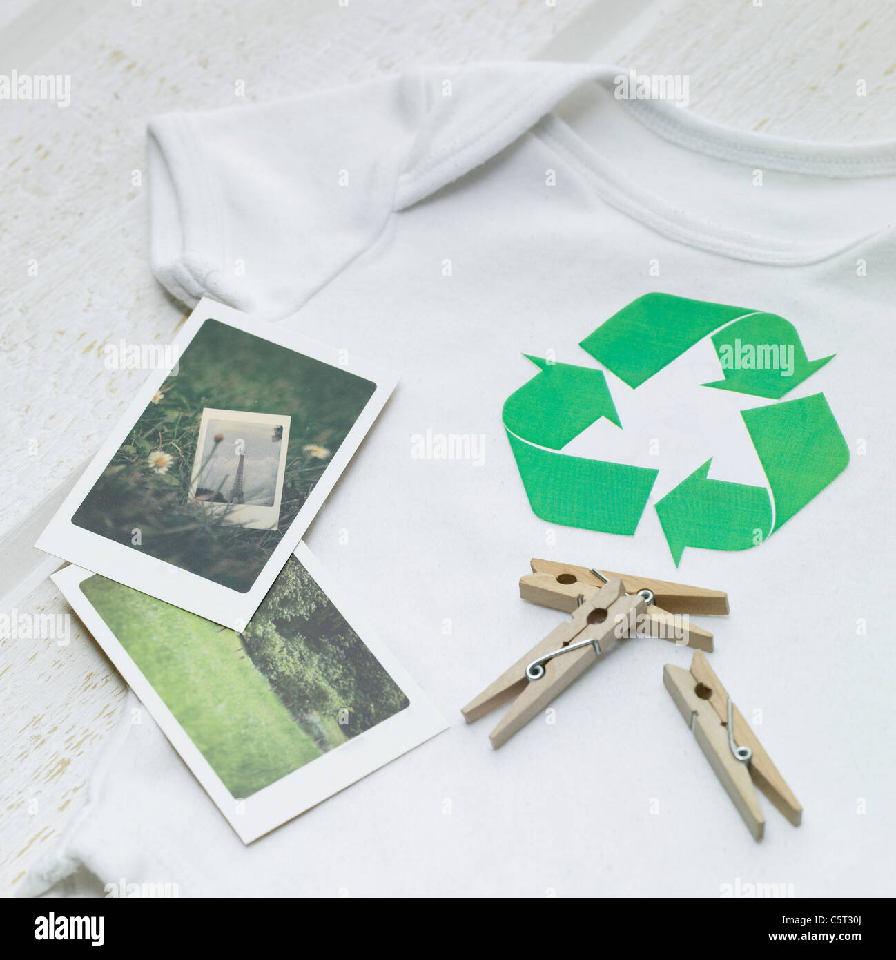 Baby's shirt, photos and clothespin Stock Photo