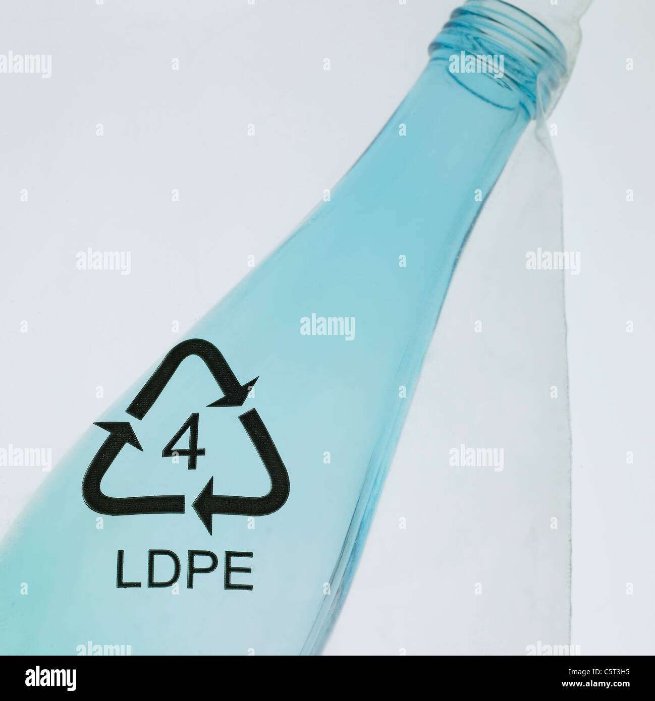 Glass bottle in a plastic bag Stock Photo