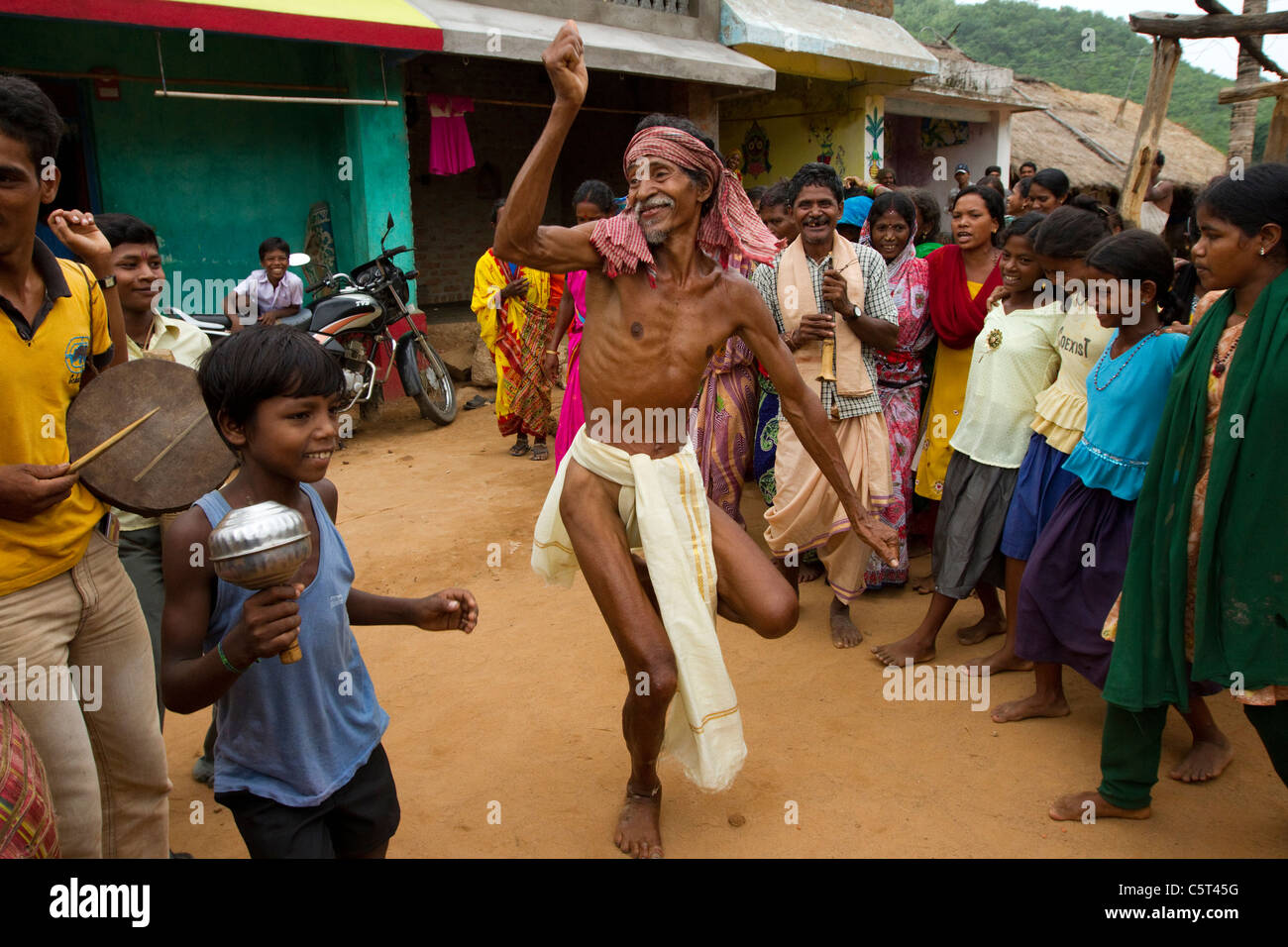 A tribal man dancing happily in India Stock Photo