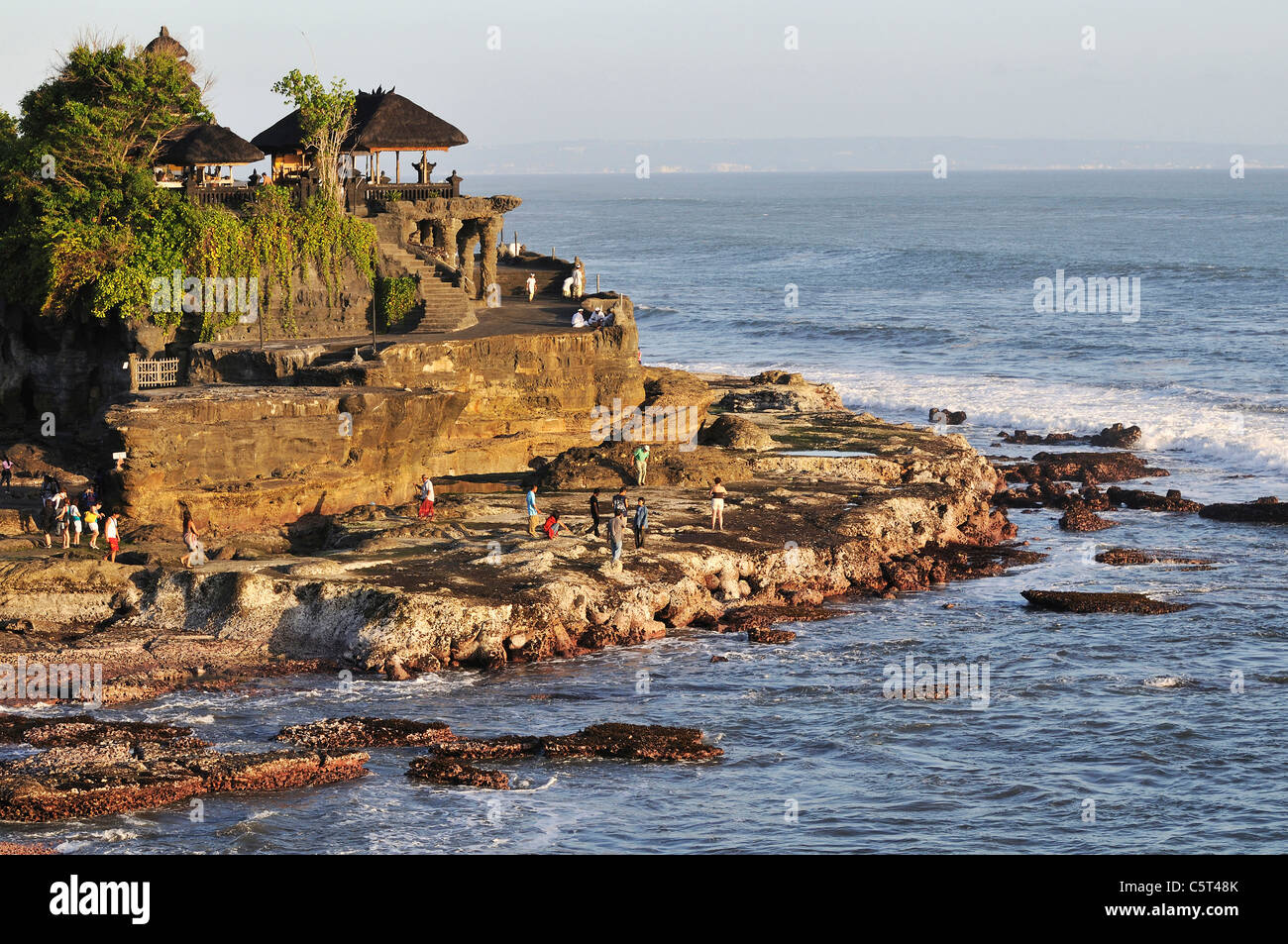 Indonesia, Bali, Tanah Lot Temple on offshore rock with tourists Stock ...