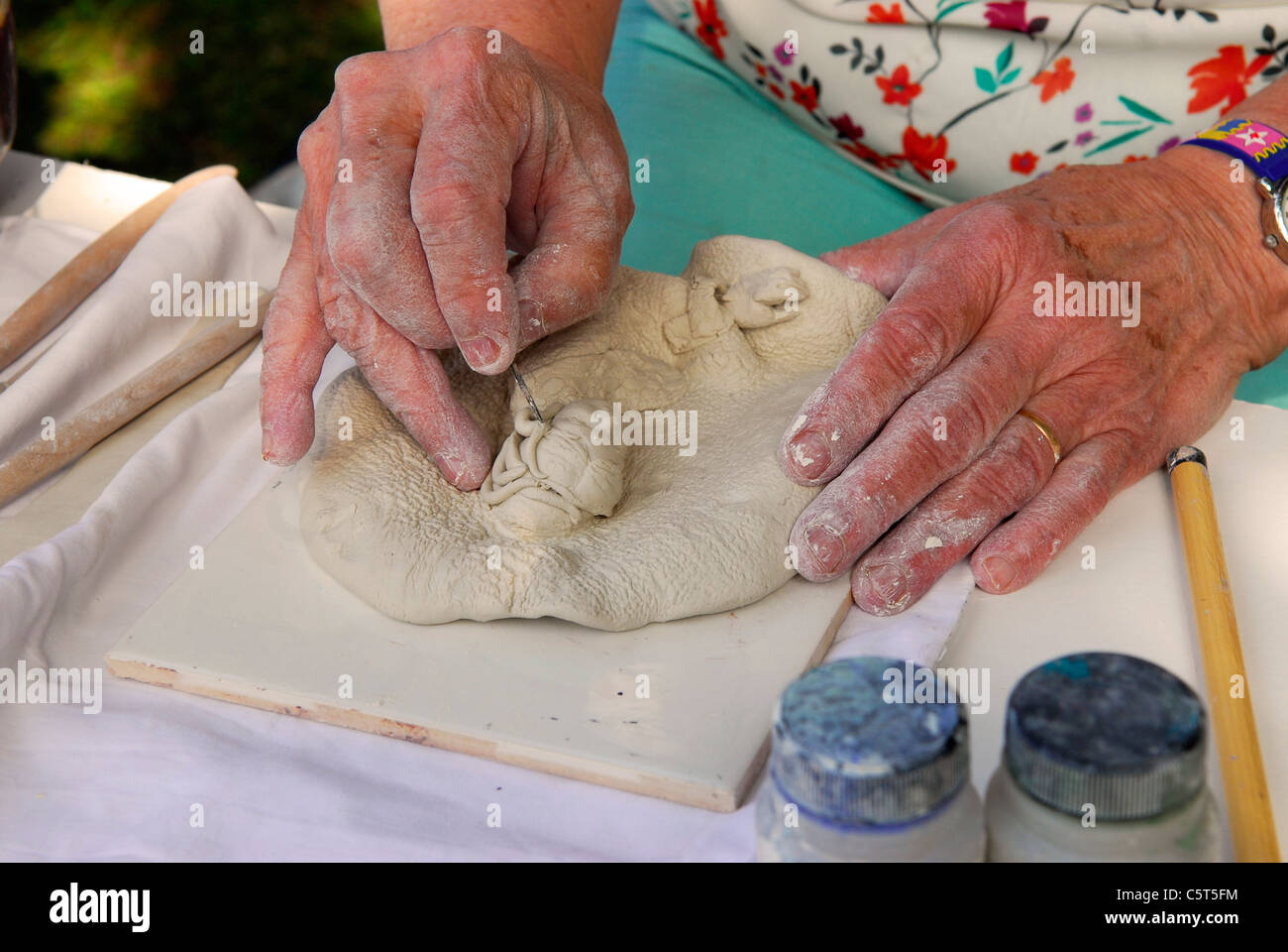 Lady demonstrating the art of ceramic sculpture at Rustic Sunday, an annual event celebrating traditional rural ways of life Stock Photo