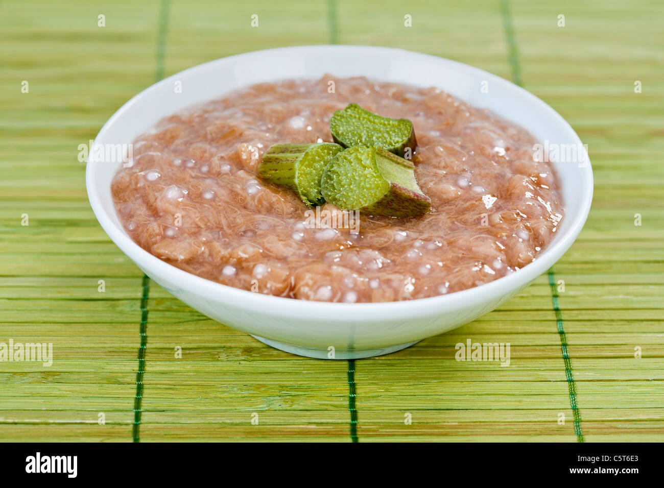 Rhabarber compote with sago on table mat Stock Photo
